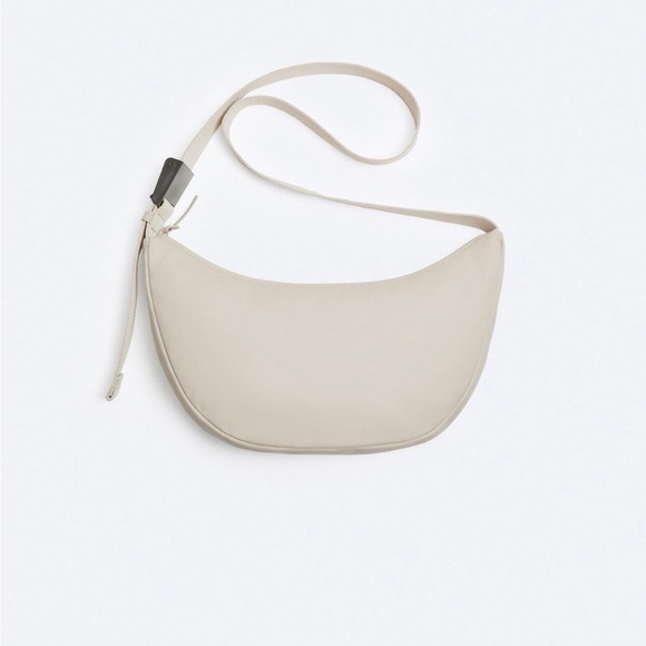 Zara Handbags - Zara Taupe / Sand Crossbody bag. Rubberized . Tonal adjustable shoulder strap.